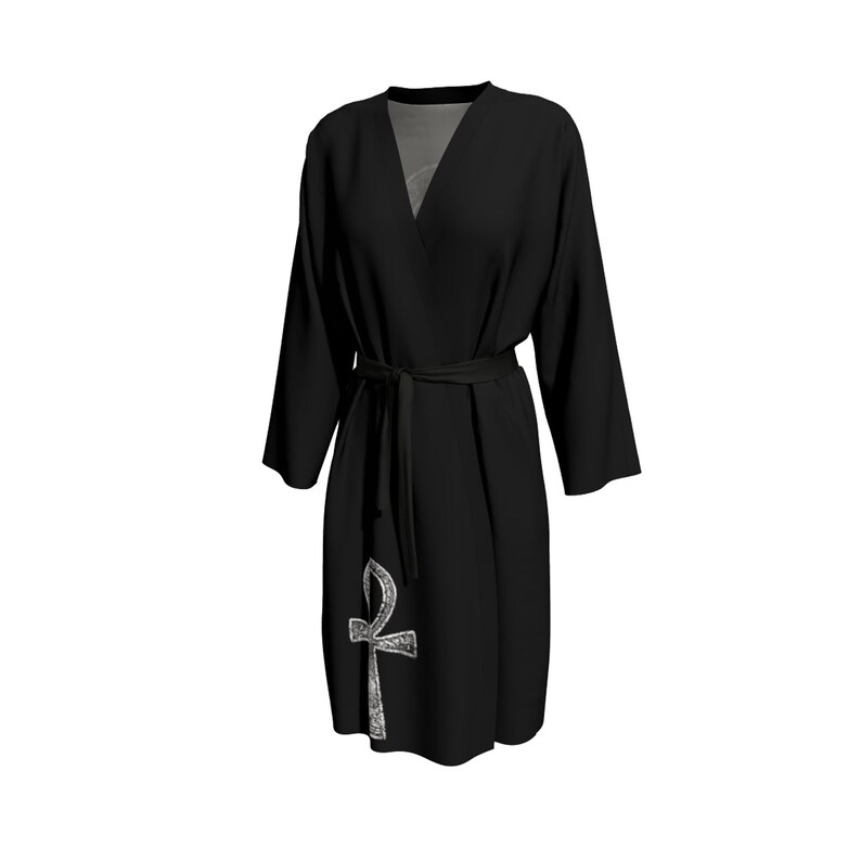 May include: Black robe with a silver Ankh symbol on the front. The robe has a tie belt and long sleeves.