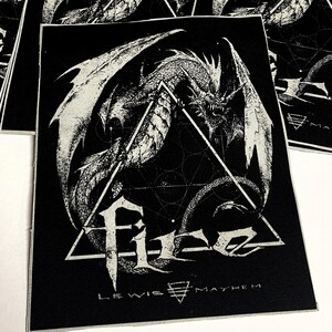 May include: Black and white embroidered patch featuring a dragon with wings spread, a geometric design, and the text "Lewis Mayhem".