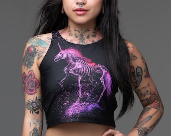 May include: A black crop top with a pink and purple skeleton unicorn graphic. The top has a racerback style and is made of a soft, stretchy fabric.