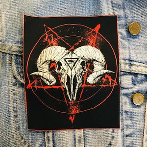 May include: Black patch with a white ram skull in the centre. The skull is surrounded by a red pentagram and a red circle.