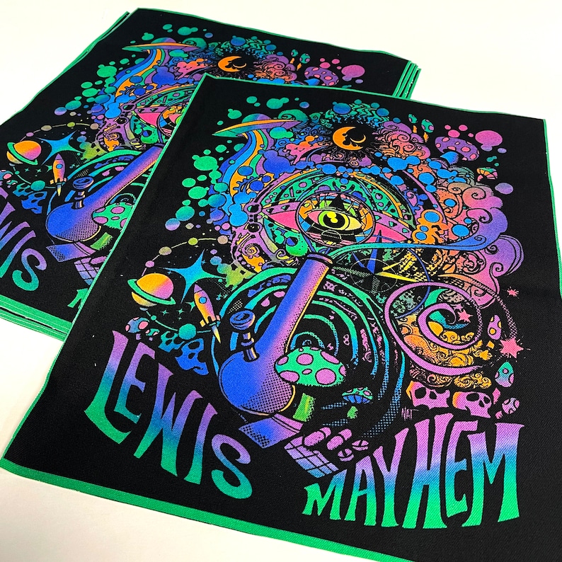 May include: Black and green fabric patch with a psychedelic design featuring a large, colorful bong, a swirling eye, and the text "Lewis Mayhem".