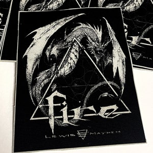 May include: Black and white embroidered patch featuring a dragon with wings outstretched, a geometric design, and the text "Lewis Mayhem".