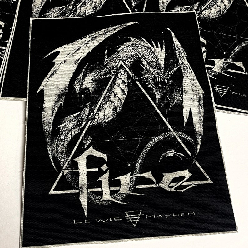 May include: Black and white embroidered patch featuring a dragon with wings outstretched, a geometric design, and the text "Lewis Mayhem".
