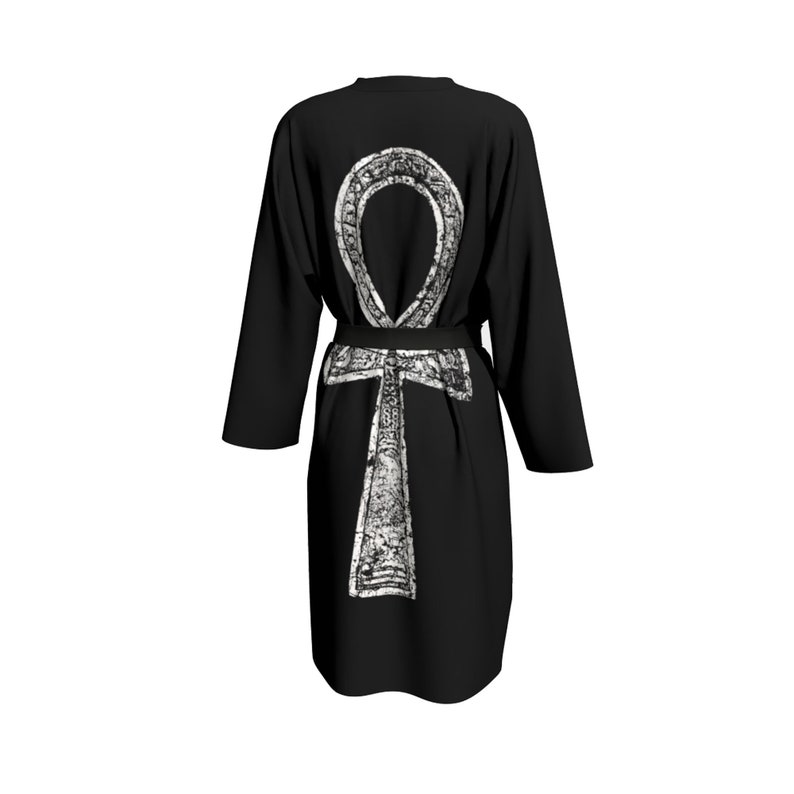 May include: Black robe with a white Ankh symbol printed on the back. The robe has a black belt.