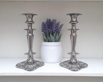 A pair of beautiful Victorian/ Edwardian silver plated ornate, embossed candlestick.