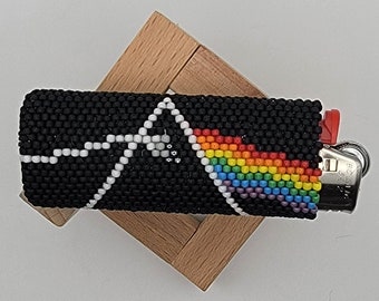 Funda para encendedor de Pink Floyd "Just Another Bead in the Wall"