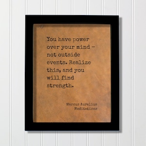 May include: A rectangular black frame containing a tan, textured background with the black printed text: You have power over your mind - not outside events. Realize this, and you will find strength. Marcus Aurelius Meditations.