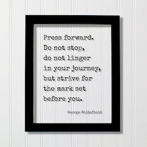 May include: Black framed print with a white background and a motivational quote in black text: "Press forward. Do not stop, do not linger in your journey, but strive for the mark set before you." The quote is attributed to George Whitefield.