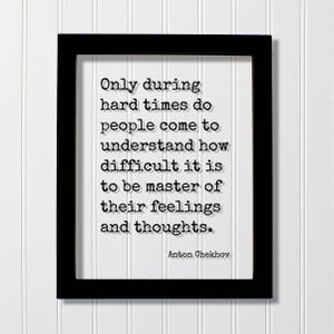 May include: A framed print with a black frame and white background. The text reads: "Only during hard times do people come to understand how difficult it is to be master of their feelings and thoughts." The author is Anton Chekhov.