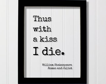 May include: Black and white framed print with the text "Thus with a kiss I die."  The text is in a typewriter font.  The quote is attributed to William Shakespeare, Romeo and Juliet.