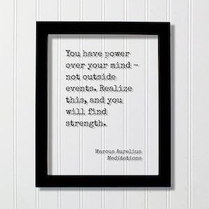 May include: Black framed print with a white background and a quote in black text: "You have power over your mind - not outside events. Realize this, and you will find strength." The quote is attributed to Marcus Aurelius, Meditations.