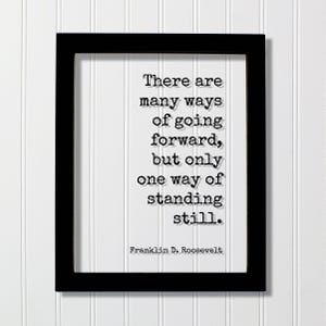May include: Black framed print with the quote "There are many ways of going forward, but only one way of standing still." The quote is attributed to Franklin D. Roosevelt. The background is white.