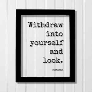 May include: Black framed print with a white background and black text that reads "Withdraw into yourself and look." The text is in a typewriter font. The author, Plotinus, is listed below the text.