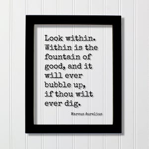 May include: A black rectangular frame containing a white print with the black typewriter-style text: Look within. Within is the fountain of good, and it will ever bubble up, if thou wilt ever dig. Marcus Aurelius is printed at the bottom right.
