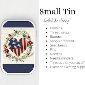 May include: A small blue tin with a white wooden background and a red, white, and blue heart with a wreath of flowers around it. The text "Small Tin" and "Perfect for storing" is written in black on a white background. The tin is perfect for storing small items like bobbins, thread drops, buttons, spools of thread, seed beads, pins, needles, needle minders, threads that you cut off, and diamond painting supplies.