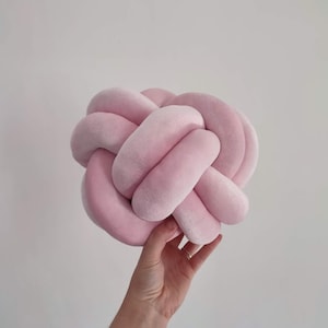 Pink knot pillow in ball shape. Decorative pillow in velur pink color.
Beautiful home decor addition. This pillow is handmade with high quality materials.