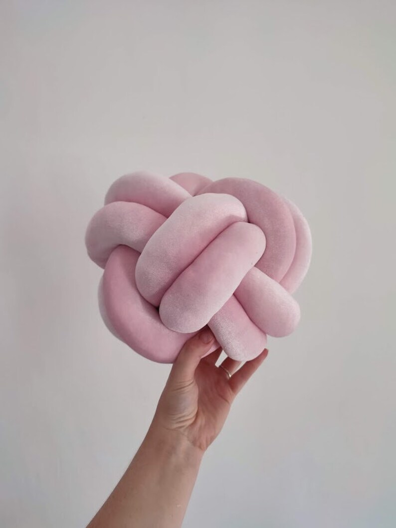 Pink knot pillow in ball shape. Decorative pillow in velur pink color.
Beautiful home decor addition. This pillow is handmade with high quality materials.