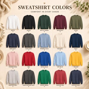 May include: A display of crewneck sweatshirts in various colors, including white, black, bottle green, burgundy, and olive. The image also shows deep navy, dark grey, mineral blue, natural, navy, powder rose, red, royal blue, sky blue, yellow, heather grey, dark heather grey, retro green, vintage red, and vintage navy.