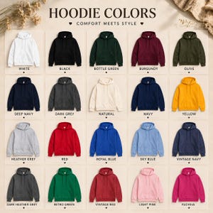 May include: A display of various hoodie colors, including white, black, bottle green, burgundy, and olive. The image showcases a range of hues, from deep navy to light pink, with the text "HOODIE COLORS" and "COMFORT MEETS STYLE" at the top.