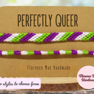 May include: Two handmade friendship bracelets in the image. The top bracelet has a chevron pattern in purple, white, and green. The bottom bracelet has a striped pattern in the same colors. The text "PERFECTLY QUEER" is above the bracelets.