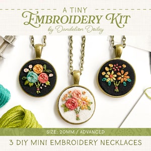 May include: A kit to make three 20mm DIY mini embroidery necklaces. The kit includes three pendants with pre-cut fabric, three chains, and embroidery floss. The pendants feature floral designs in shades of pink, yellow, and green.
