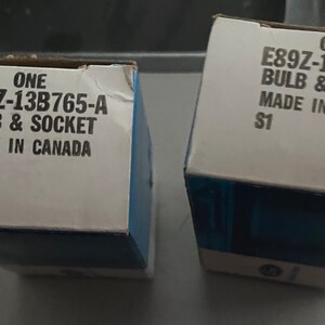 Vintage Ford NOS E89z-13b765-a bulb and socket. You get 2 mint in box. Brand new in OEM Ford box. No international sales.