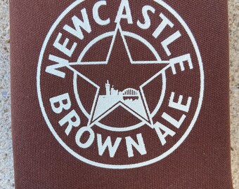 Vintage Newcastle brown ale koozie as new. Announce and advertise your favorite beer! No international sales!