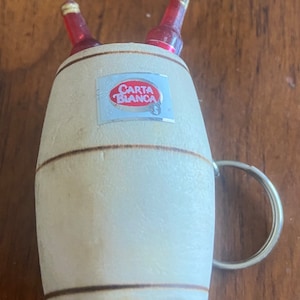 Vintage Carta Blanca Beer keychain. wood barrel, plastic bottles with Carta Blanca sticker. About 1980’s. No international sales.