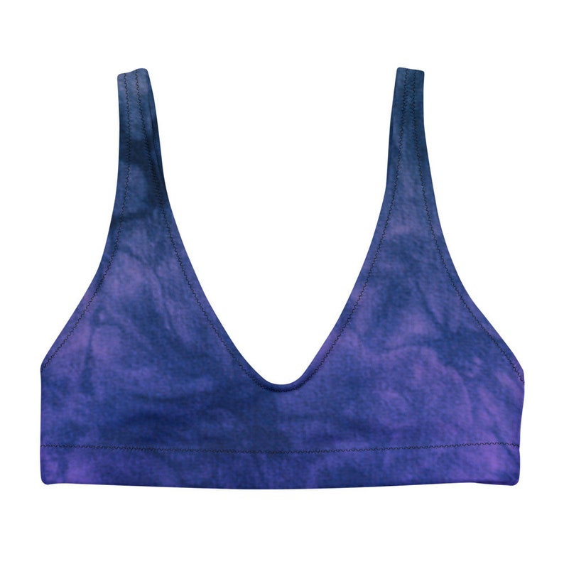 A flat photo of the bikini top alone. The color is a deep purple with hits of blue in a tie dye pattern. Bikini top and bottom are sold separately.