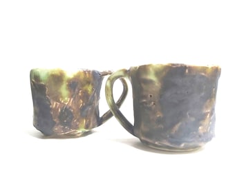Intriguing green and black tea cups /  coffee mugs, etched, in various glaze finishes in white stoneware