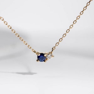 Genuine blue sapphire and diamond necklace for women and girls in 14K yellow gold.