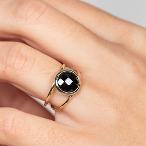 Modern double band ring made of 14K gold with a genuine black onyx gemstone. This statement ring is great for women.