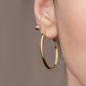 14K Gold Oval Hoop Earrings: Lightweight Solid Gold Hoops (36x22 mm)  GE00150