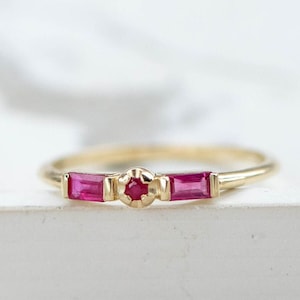 Natural ruby ring in 14K solid gold. A stacking ring with two baguette rubies and a round one in the middle.