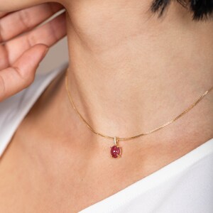 Short necklace made of 14K solid yellow gold with a natural pink tourmaline and diamonds