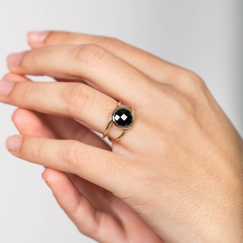 Modern double band ring made of 14K gold with a genuine black onyx gemstone. This statement ring is great for women.