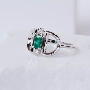 Statement ring with natural emerald and diamonds in white gold
