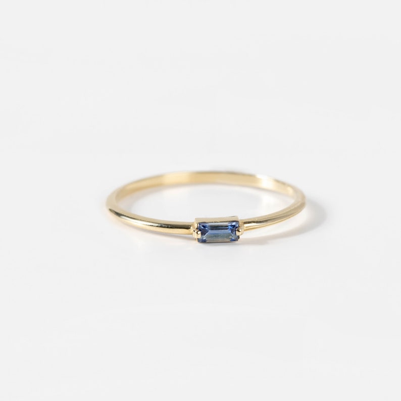 Vivid blue sapphire ring in 14K solid gold, ideal for stacking with more baguette gemstone rings.