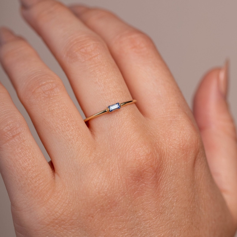 Stackable gemstone ring with a natural blue sapphire in 14K solid yellow gold.
