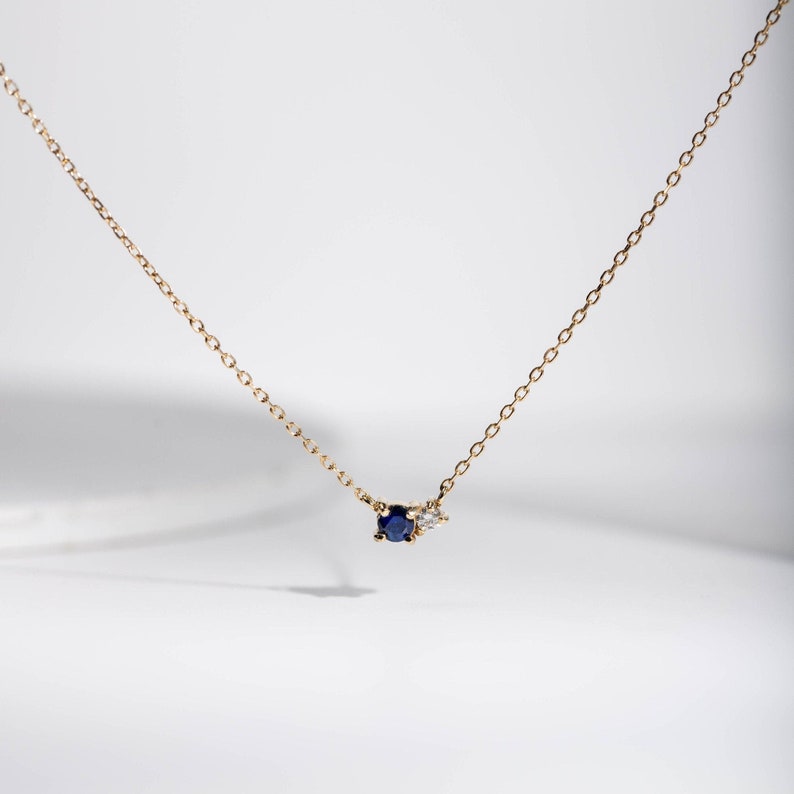 Genuine blue sapphire and diamond necklace for women and girls in 14K yellow gold.