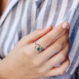 Art deco emerald diamonds ring in 14k solid white gold on finger