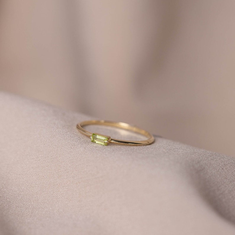 Genuine peridot gemstone ring in 14k solid gold, dainty and minimalist, ideal for stacking with more thin rings.