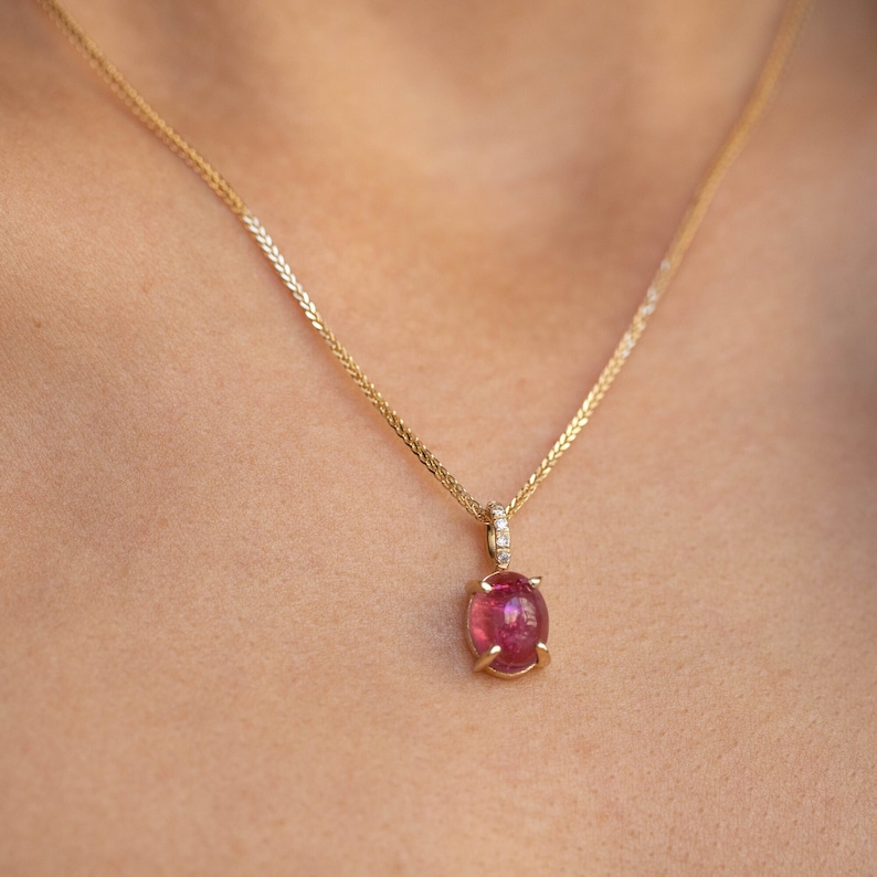 Pink tourmaline and diamonds necklace for women in 14K gold. The pendant is a great choice for a birthday gift as tourmaline is the October birthstone.