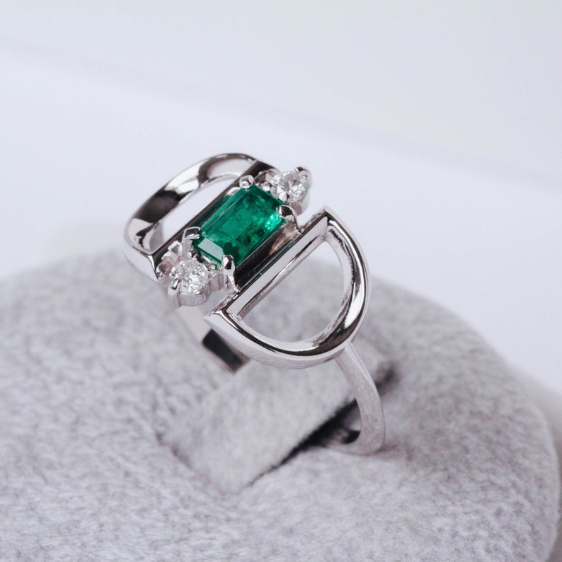 Emerald diamonds engagement ring in 14K white gold on its package ready for wedding proposal