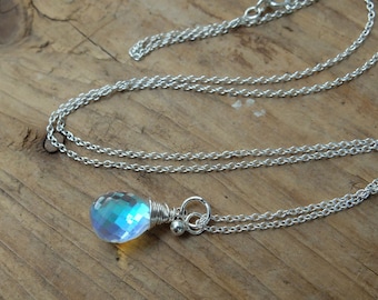 Blue mystic aura quartz stone, also called mermaid stone and angel quartz, on a sterling silver chain necklace. With a beautiful blue flash.