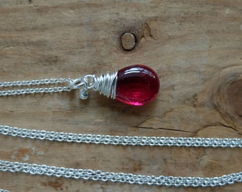 Rose Red Rubellite drop necklace, a sterling silver chain necklace with spring clasp and a red gemstone.