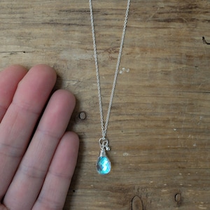 Blue mystic aura quartz stone, also called mermaid stone and angel quartz, on a sterling silver chain necklace. With a beautiful blue flash.