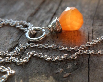 Beautiful sterling silver necklace with carnelian, facetted briolette / gemstone, on a sterling silver chain. Orange gemstone jewelry.