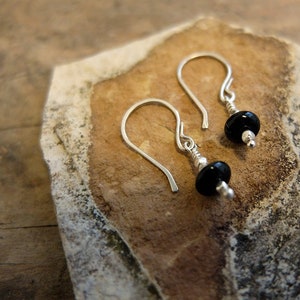 Black gemstone (onyx) and sterling silver drop earrings, sturdy sterling silver hooks, combined with black gemstones.