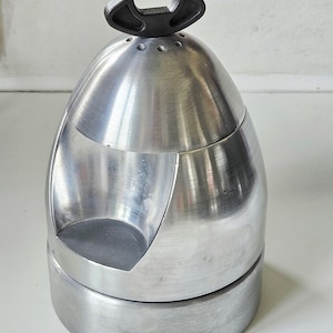 May include: A set of three ceramic mugs with a speckled, matte finish. The mugs are in shades of cream, light gray, and dark gray. Each mug has a simple, minimalist design, perfect for coffee or tea.